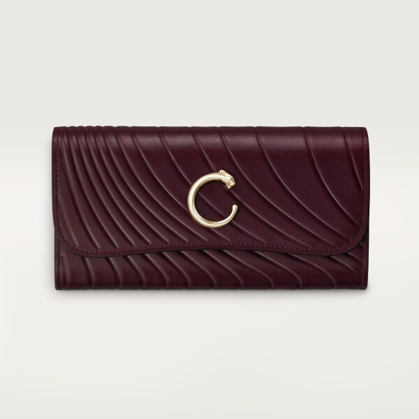 International wallet with flap, Panthère C Grape calfskin, embossed Cartier signature motif, golden finish