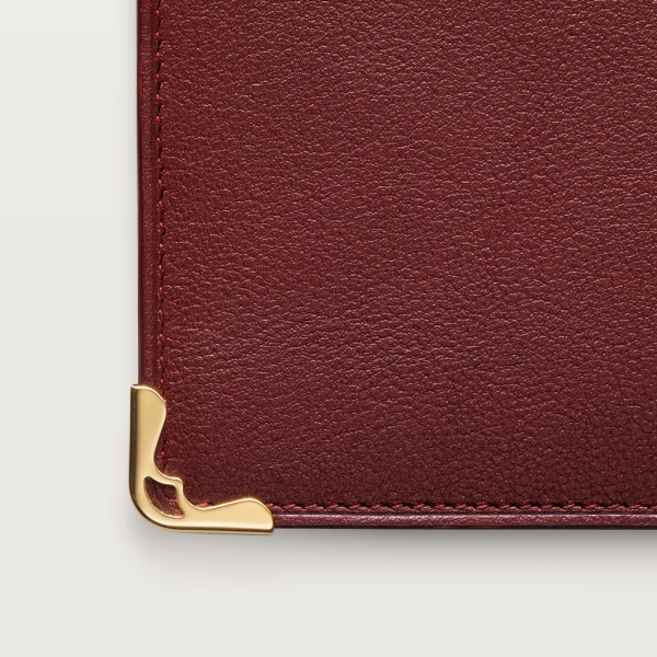 International Wallet with Gussets, Must de Cartier Burgundy calfskin, golden finish