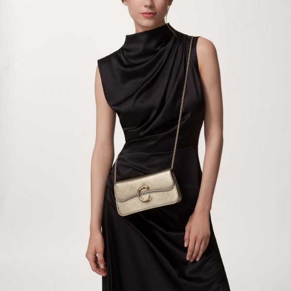 Chain bag mini, Panthère de Cartier Golden metallic calfskin, golden and black enamel finish