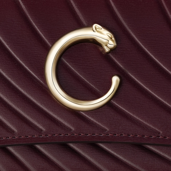 International wallet with flap, Panthère C Grape calfskin, embossed Cartier signature motif, golden finish