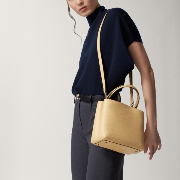 Small model handle bag, Panthère Double de Cartier Mimosa yellow calfskin, golden finish