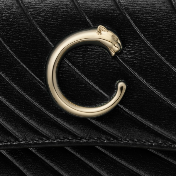 International wallet with flap, Panthère de Cartier Black calfskin with embossed Cartier signature motif, golden finish