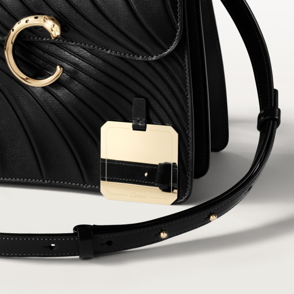 Handle bag mini model, Panthère de Cartier Black calfskin, embossed Cartier signature motif, golden finish