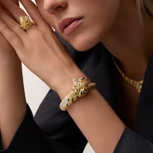Faune et Flore de Cartier bracelet, yellow, orange and brown diamonds, paved  Yellow gold, onyx, emeralds, yellow diamonds, orange diamonds, brown diamonds, diamonds