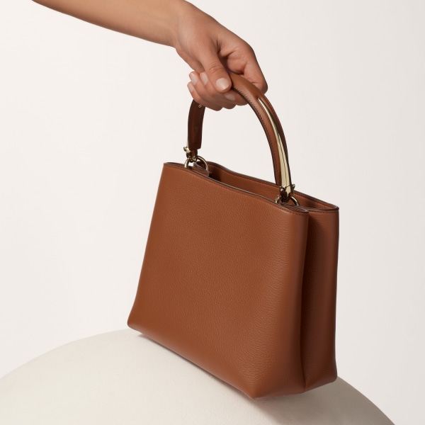 Top handle bag small model, Panthère de Cartier Handle bag, caramel grained calfskin, golden finish