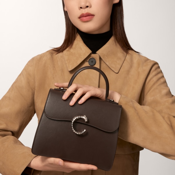 Top handle bag small model, Panthère de Cartier Tonka brown calfskin, palladium finish, zebra motif
