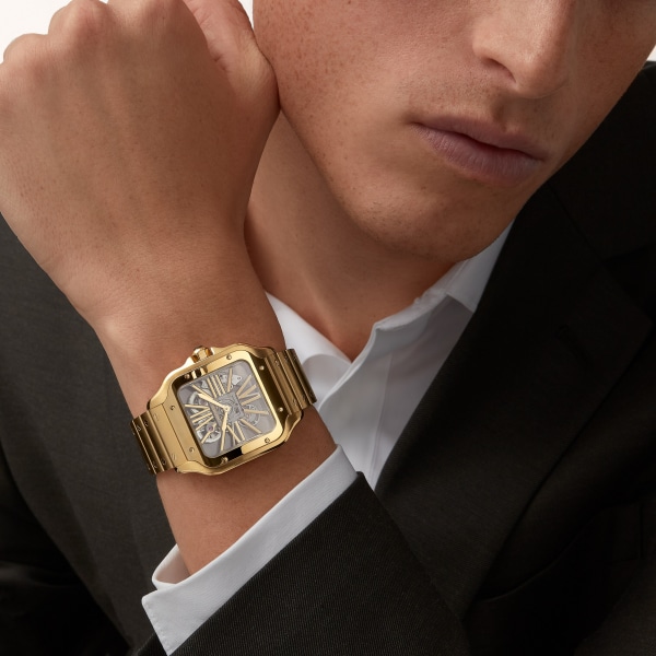 Santos-Dumont watch Large model, manual skeleton movement, yellow gold, interchangeable metal and leather straps