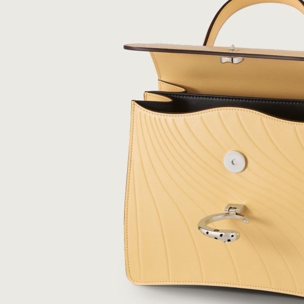 Small model handle bag, Panthère C de Cartier Mimosa yellow calfskin, embossed with Cartier signature motif, palladium finish
