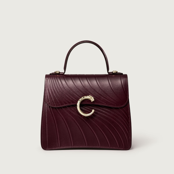 Small model handle bag, Panthère C de Cartier Grape calfskin, embossed Cartier signature motif, golden finish