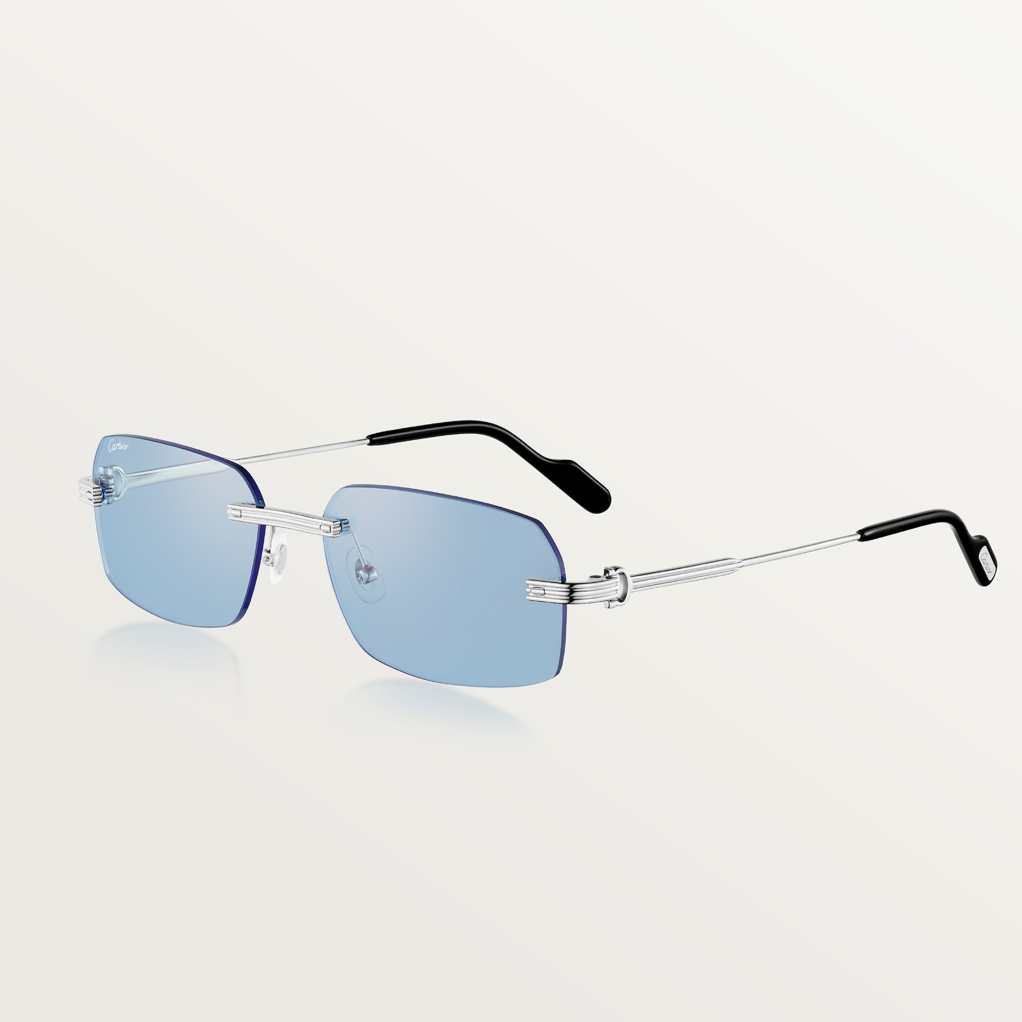 Première de Cartier SunglassesSmooth platinum-finish metal, light blue lenses