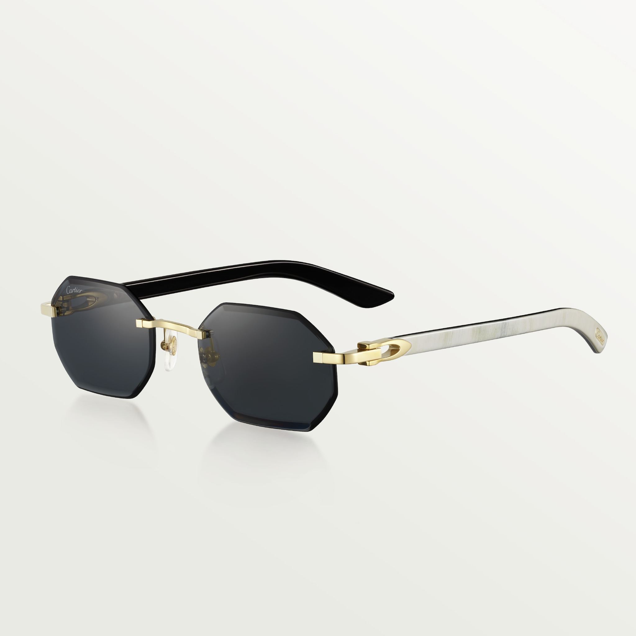 Sunglasses with Elongated C de Cartier motifSmooth golden-finish metal, grey lenses