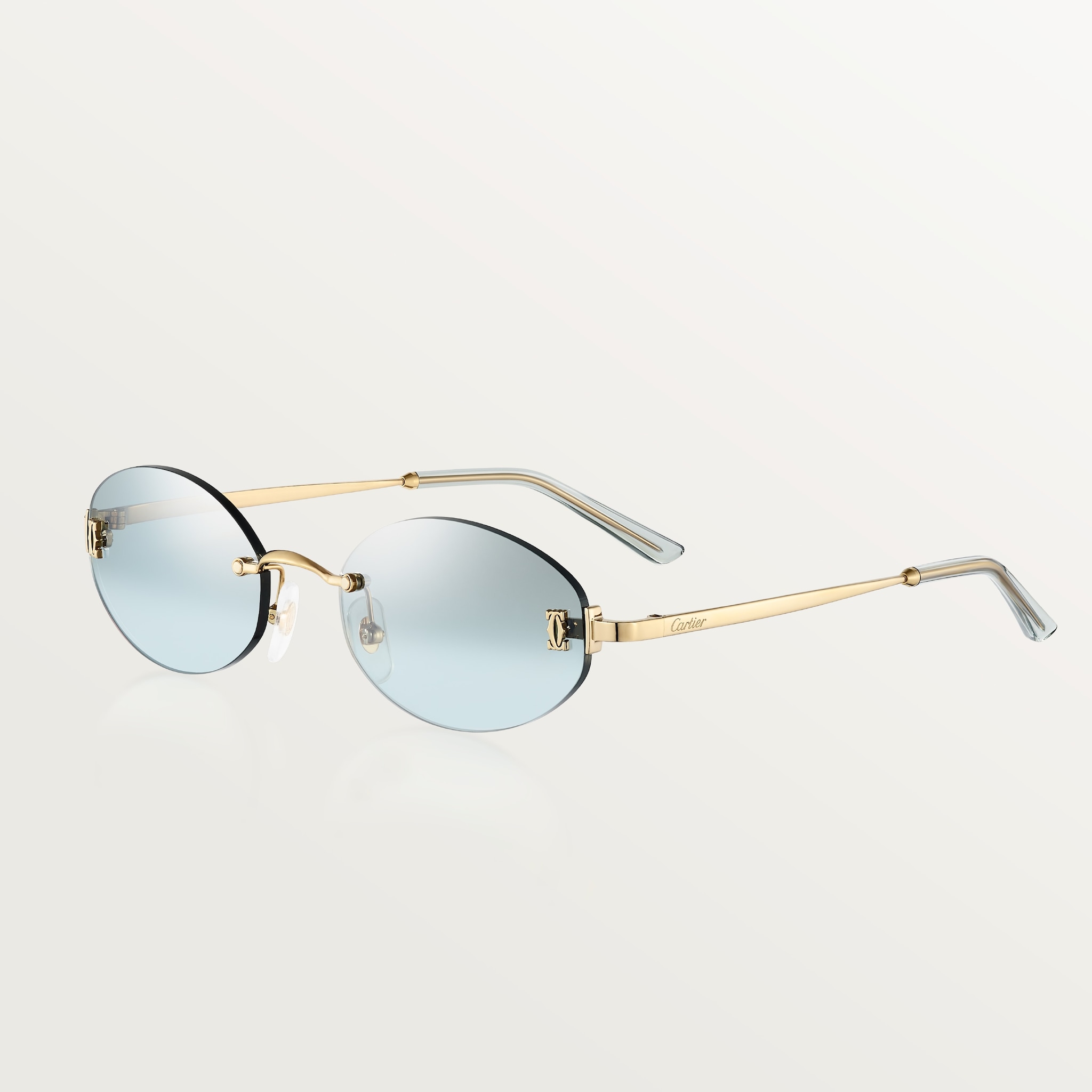C de Cartier SunglassesSmooth golden-finish metal, light blue lenses