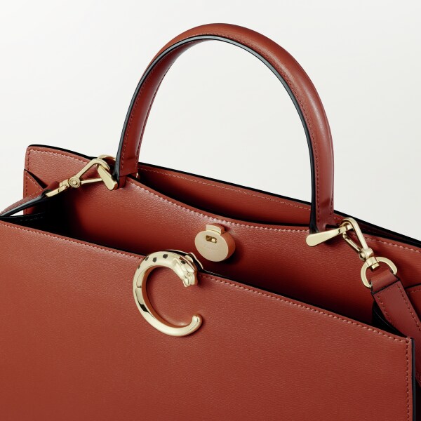 Panthère de Cartier bag, Top handle bag Chestnut calfskin, golden finish and black enamel