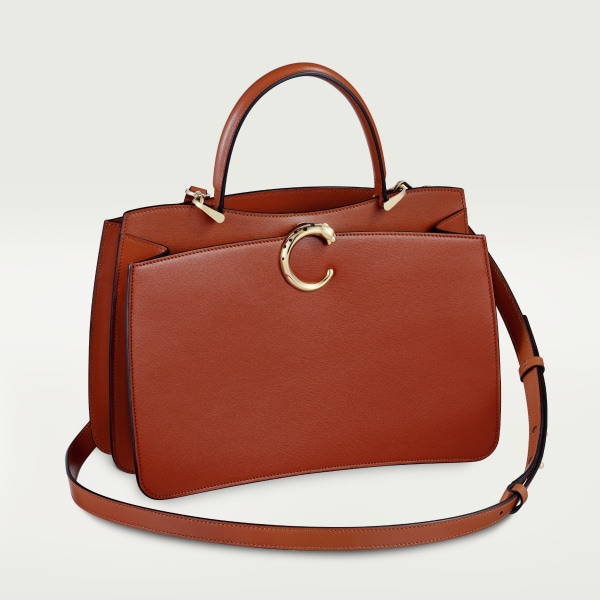 Panthère de Cartier bag, Top handle bag Chestnut calfskin, golden finish and black enamel