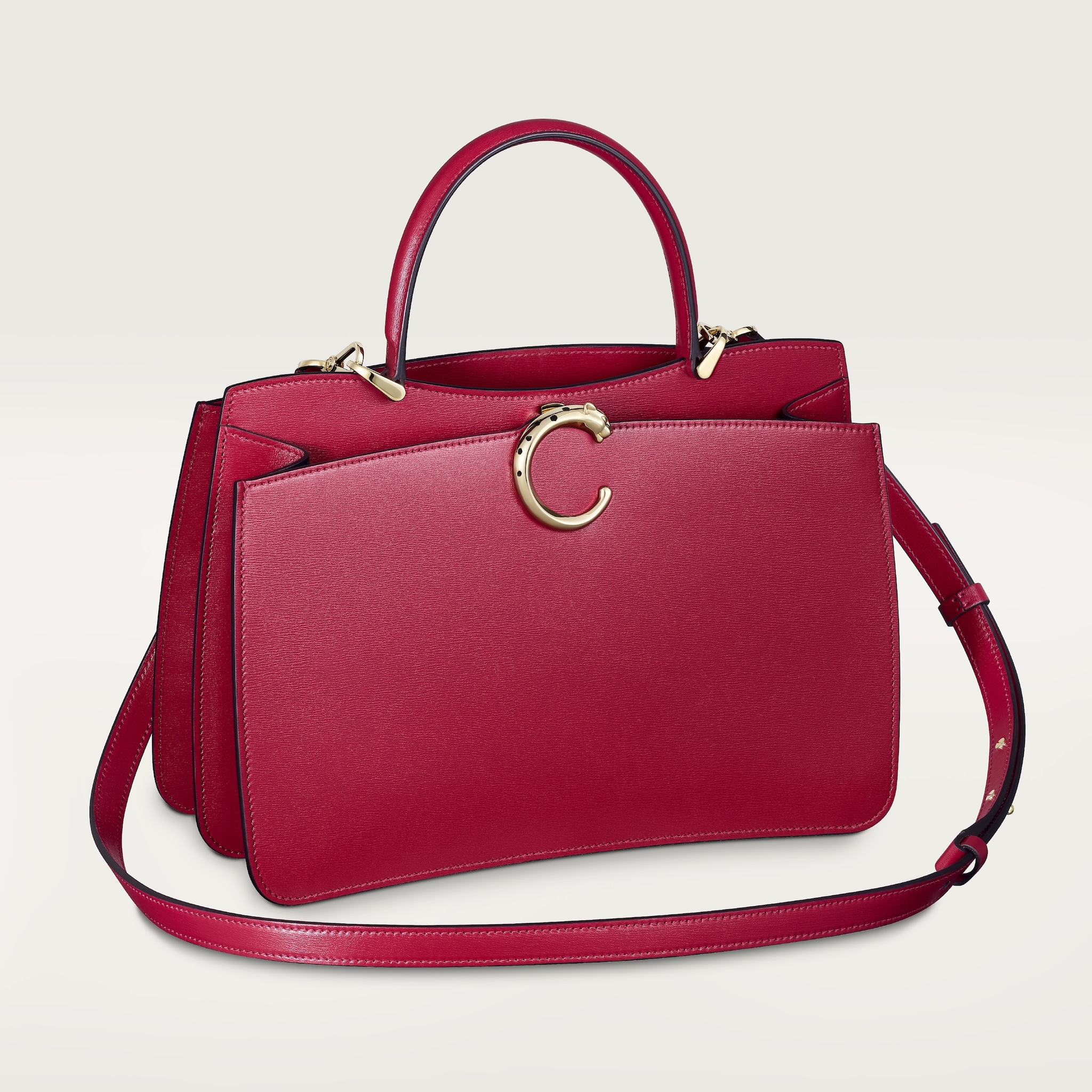 Top handle bag small model, Panthère de CartierCherry red calfskin, golden finish