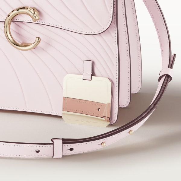Top handle bag small model, Panthère de Cartier Petal pink calfskin, embossed Cartier signature motif, golden finish
