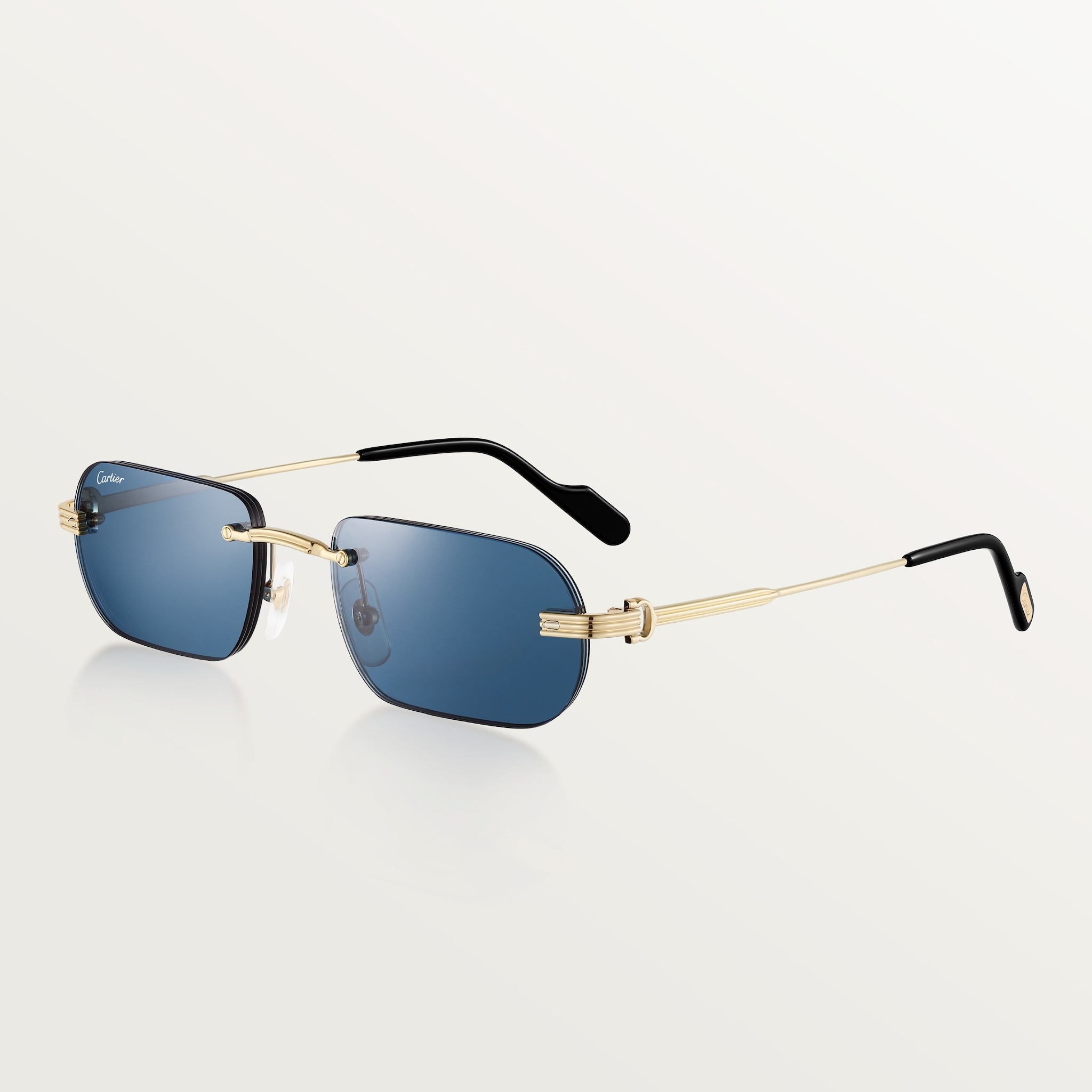 Première de Cartier SunglassesSmooth golden-finish metal, blue lenses 