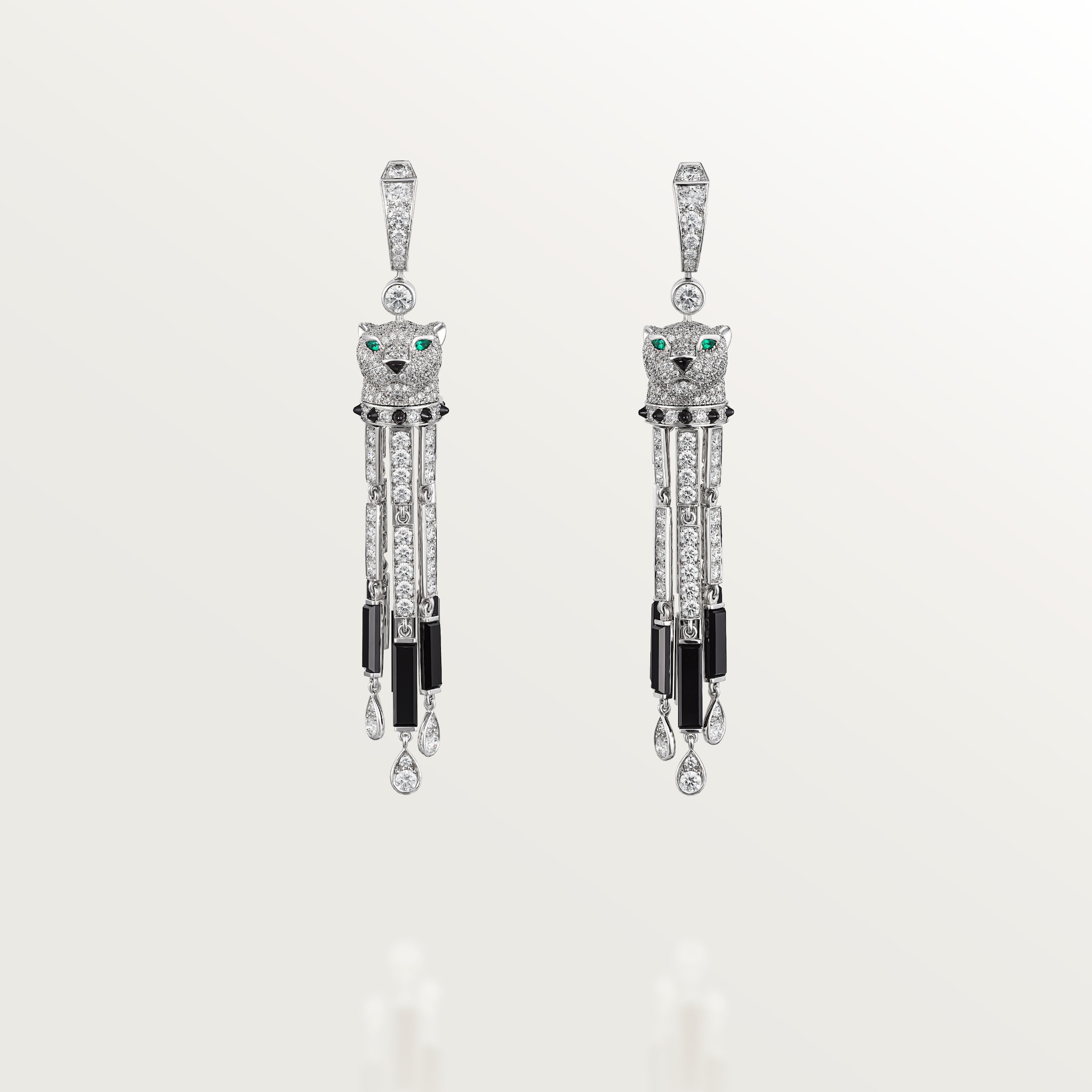 Panthère de Cartier earringsWhite gold, onyx, emerald, diamonds.