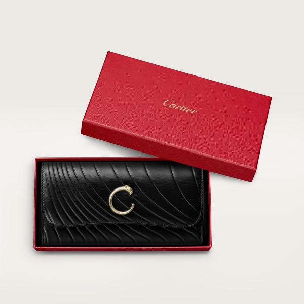 International wallet with flap, Panthère de Cartier Black calfskin with embossed Cartier signature motif, golden finish