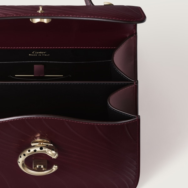 Small model handle bag, Panthère C de Cartier Grape calfskin, embossed Cartier signature motif, golden finish