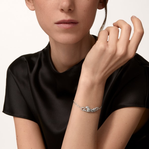Panthère de Cartier bracelet, on chain, semi-paved White gold, emeralds, diamonds