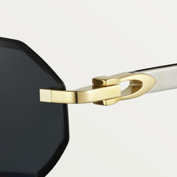 Sunglasses with Elongated C de Cartier motif Smooth golden-finish metal, grey lenses