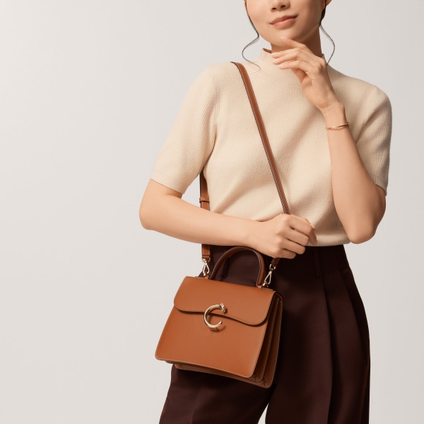 Top handle bag small model, Panthère de Cartier Caramel calfskin, golden finish