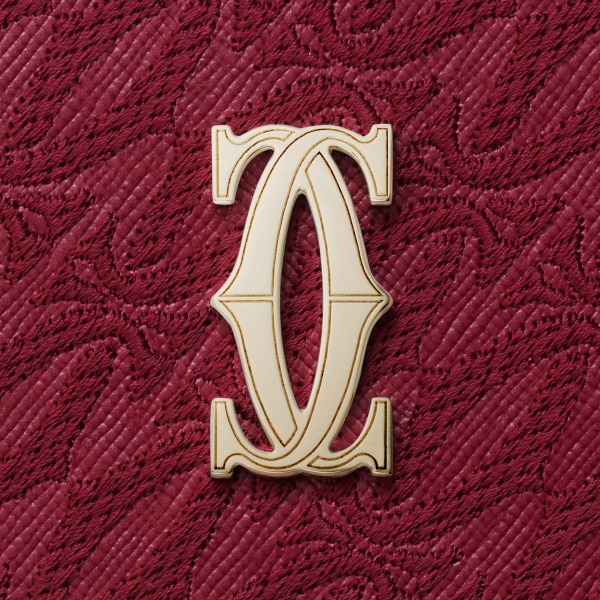 International zipped wallet, C de Cartier Cherry red textured calfskin, embroidery, golden finish