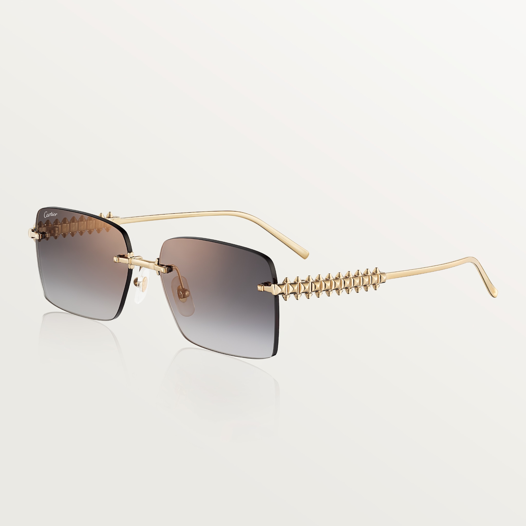Clash de Cartier SunglassesSmooth golden-finish metal, grey lenses