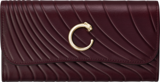 International wallet with flap, Panthère C Grape calfskin, embossed Cartier signature motif, golden finish
